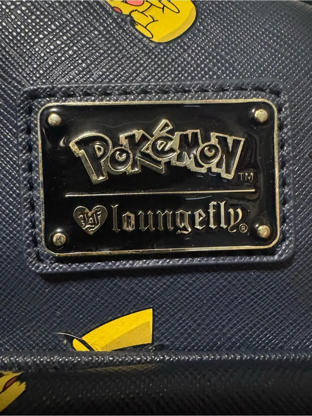 Loungefly Navy Mini Backpack with Yellow Pikachu Print